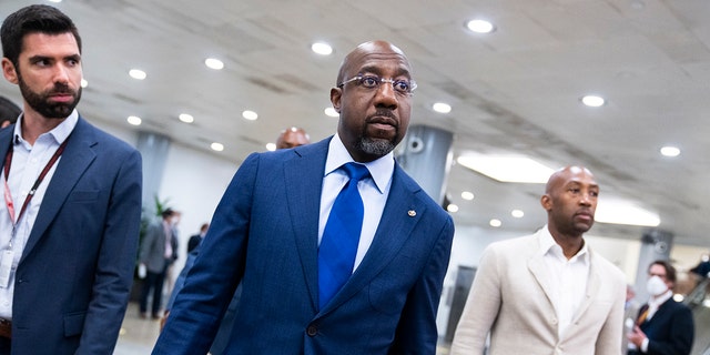 Democratic Sen. Raphael Warnock of Georgia is seen in the U.S. Capitol before the Senate luncheons, on Tuesday, May 24, 2022. 