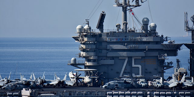 FILE- The USS Harry S. Truman aircraft carrier arrives at the French Mediterranean port of Marseille.