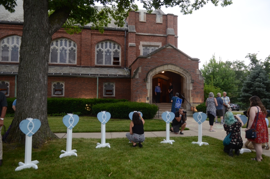 Heart shaped post honoring the seven victims who tragically lost their lives during the Highland Park mass shooting. 