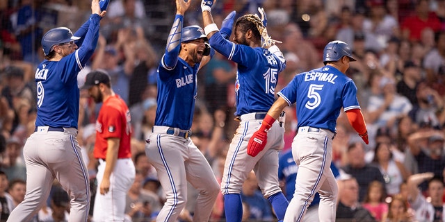 Raimel Tapia #15 of the Toronto Blue Jays reacts after hitting an inside-the-park grand slam during the third inning of a game against the Boston Red Sox on July 22, 2022 at Fenway Park in Boston, Massachusetts. 