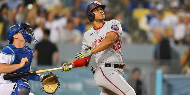 Juan Soto (22) of the Washington Nationals follows through during the fifth inning against the Los Angeles Dodgers at Dodger Stadium, July 26, 2022, in Los Angeles, California.