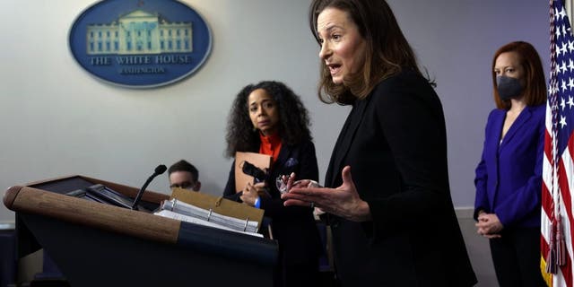 Co-Chair and Executive Director of the Gender Policy Council Jennifer Klein, center, speaks as Co-Chair of the Gender Policy Council and Chief of Staff to the first lady Julissa Reynoso, left, and White House press secretary Jen Psaki, right, listen during a daily press briefing at the James Brady Press Briefing Room of the White House March 8, 2021, in Washington, D.C.