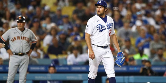 Trevor Bauer #27 of the Los Angeles Dodgers looks on during the sixth inning against the San Francisco Giants at Dodger Stadium on June 28, 2021 in Los Angeles, California. 