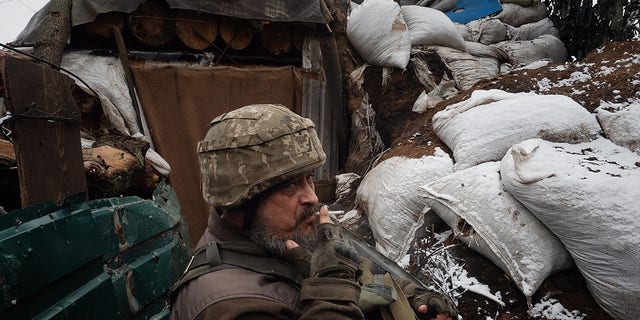 Vitaly, 52, says he is of Russian origin and fought in the Russian army during the first Chechen war, but today fights alongside Ukrainian soldiers on Feb. 9, 2022, in Pisky, Ukraine. Originally from Donetsk, Vitaly says he  saw his city invaded and people massacred.