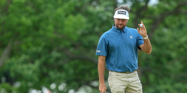 Bubba Watson, of the United States, reacts to his putt with a ball wave on the first green during the final round of the 2022 PGA Championship at Southern Hills Country Club on May 22, 2022 in Tulsa, Oklahoma. 