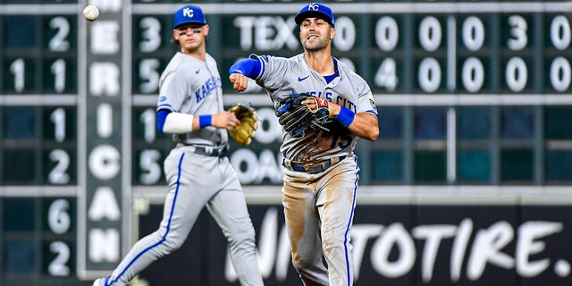 Whit Merrifield #15 of the Kansas City Royals fields a ball in the 5th inning against the Houston Astros at Minute Maid Park on July 05, 2022 in Houston, Texas. 