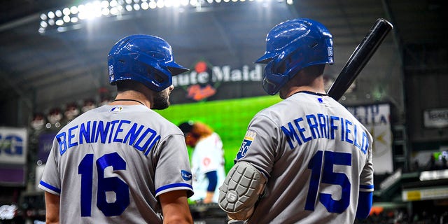 Andrew Benintendi of the Kansas City Royals talks to teammate Whit Merrifield during a game against the Houston Astros at Minute Maid Park July 6, 2022, in Houston. 