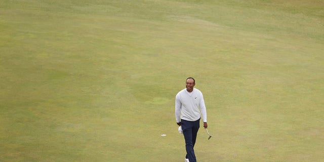 Tiger Woods acknowledges the crowd on the 18th green during Day Two of The 150th Open at St Andrews Old Course on July 15, 2022, in St Andrews, Scotland. 