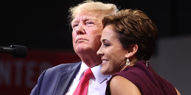 Former President Donald Trump, left, embraces Republican candidate for governor Kari Lake at a ‘Save America’ rally in support of Arizona GOP candidates on July 22, 2022 in Prescott Valley, Arizona. 