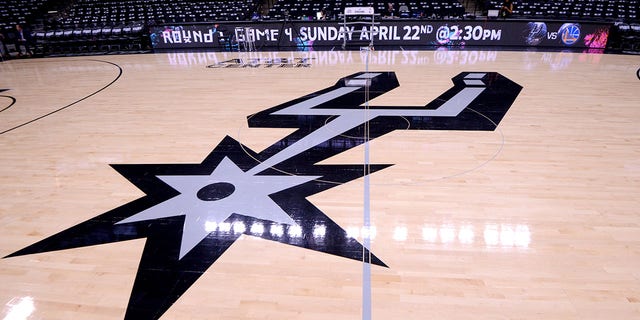 The San Antonio Spurs logo is seen before the game against the Golden State Warriors in Game Three of Round One of the 2018 NBA Playoffs on April 19, 2018, at the AT&amp;amp;T Center in San Antonio, Texas. 