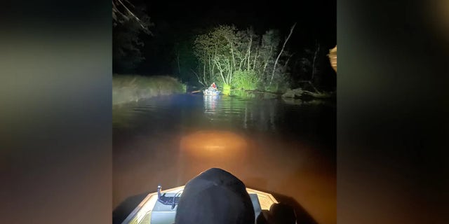 First responders had to push their boats through waist-deep water on their way to the victims after they encountered multiple log jams.