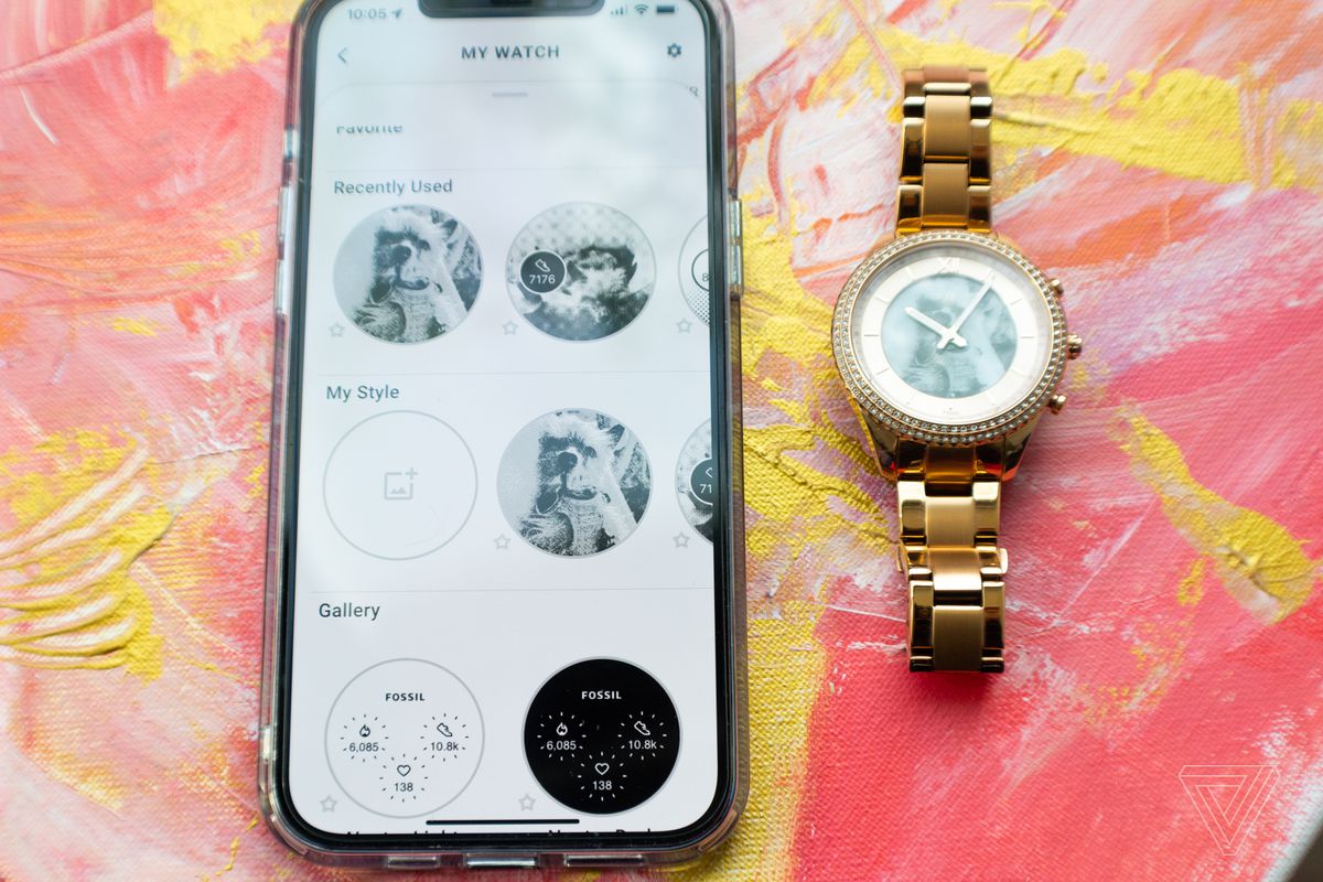 The Fossil Smartwatches app on an iPhone next to the Gen 6 Hybrid