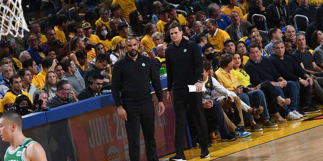 Head Coach Ime Udoka and Assistant Coach Will Hardy of the Boston Celtics look on during Game One of the 2022 NBA Finals on June 2, 2022 at Chase Center in San Francisco, California. 