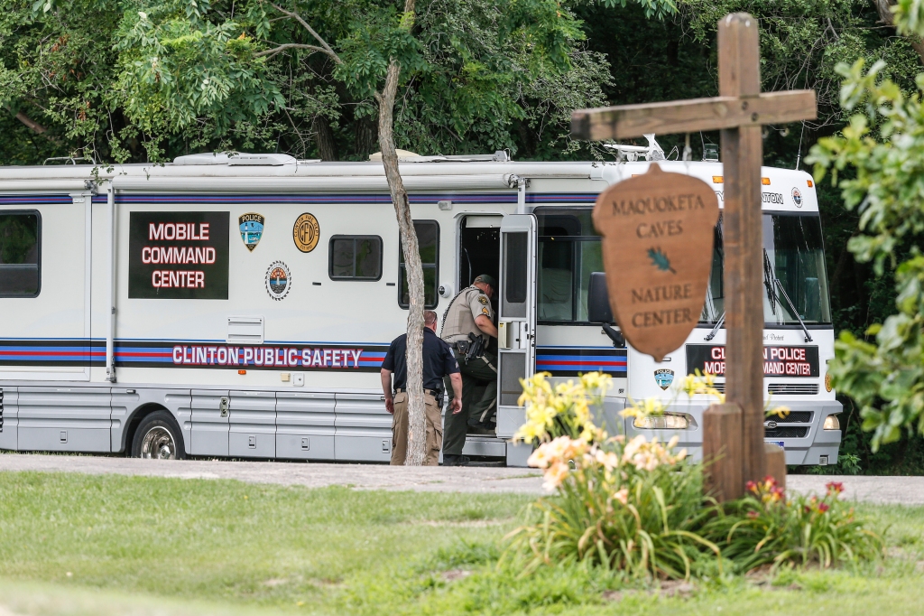 Authorities enter a mobile command center at the entrance to Maquoketa Caves State Park on July 22, 2022, in Maquoketa.