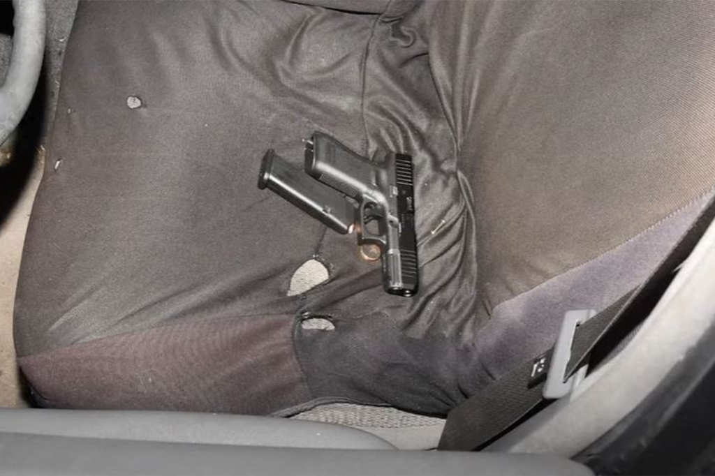 This handout image provided by the Akron Police Department on July 3, 2022, shows a handgun, loaded magazine, and gold ring that police say they found in the vehicle of 25 year old Jayland Walker during a traffic stop in Akron, Ohio, on June 27, 2022. 