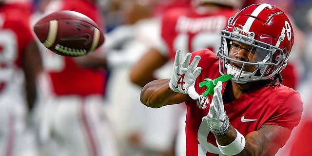 Alabama wide receiver John Metchie III (8) warms up prior to the start of the SEC Championship between the Alabama Crimson Tide and Georgia Bulldogs Dec. 4, 2021, at Mercedes-Benz Stadium in Atlanta.