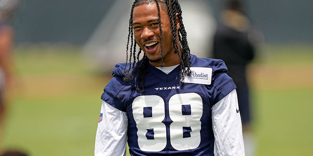 Houston Texans' John Metchie III smiles during an NFL football rookie minicamp practice on May 13, 2022, in Houston.