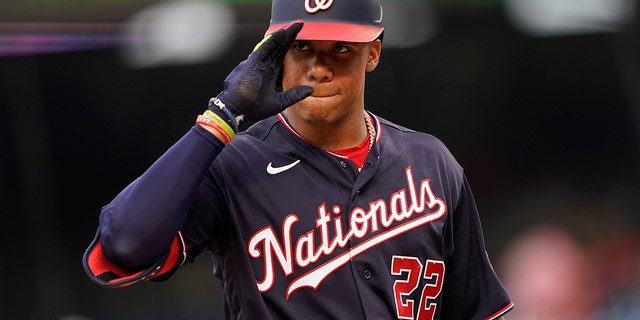 Washington Nationals' Juan Soto gestures to the visiting dugout as he gets ready for his at-bat during the first inning against the St. Louis Cardinals, Friday, July 29, 2022, in Washington.