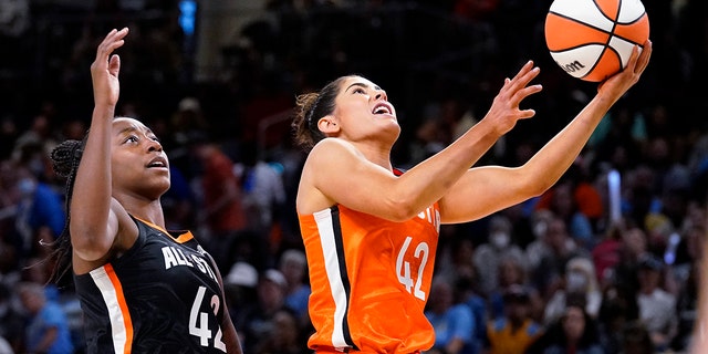 Team Wilson's Kelsey Plum, right, drives to the basket past Team Stewart's Jewell Loyd during the second half of a WNBA All-Star basketball game in Chicago, Sunday, July 10, 2022.