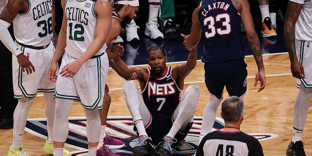 Kevin Durant, Nic Claxton, Patty Mills of Brooklyn Nets and Marcus Smart, Grant Williams of Boston Celtics in action during NBA playoffs between Brooklyn Nets and Boston Celtics at the Barclays Center in Brooklyn of New York City, United States on April 25, 2022.