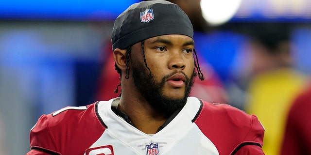 Arizona Cardinals quarterback Kyler Murray warms up before the wild-card playoff game against the Los Angeles Rams in Inglewood, California, Jan. 17, 2022.