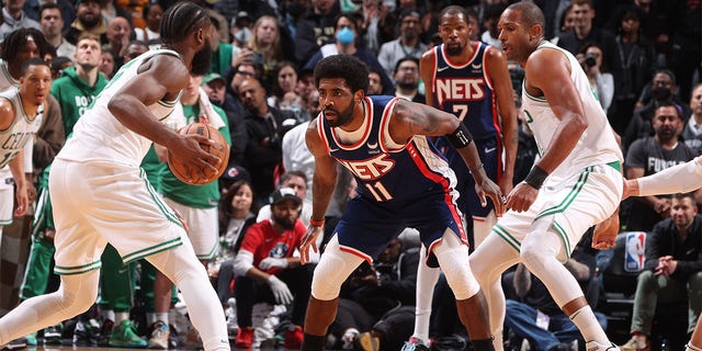 Kyrie Irving #11 of the Brooklyn Nets plays defense during Round 1 Game 4 of the 2022 NBA Playoffs on April 25, 2022 at Barclays Center in Brooklyn, New York. 