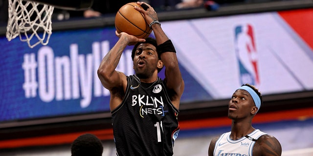 Kyrie Irving of the Brooklyn Nets takes a shot against the Los Angeles Lakes at Barclays Center on April 10, 2021, in New York City.