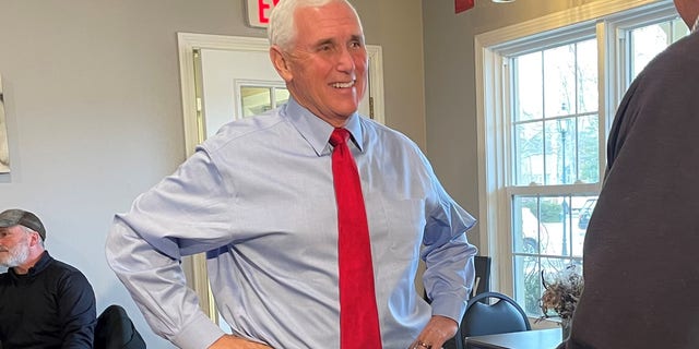 Former Vice President Mike Pence greets customers at Simply Delicious Bakery in Bedford, New Hampshire, on Dec. 8, 2021.