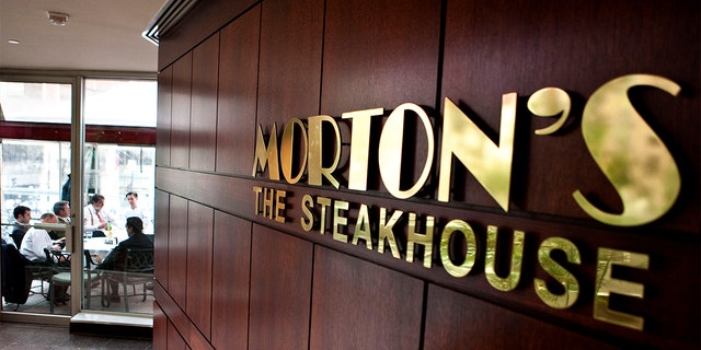 FILE - Patrons dine at Morton's in Washington, D.C., on Thursday, March 12, 2009. 