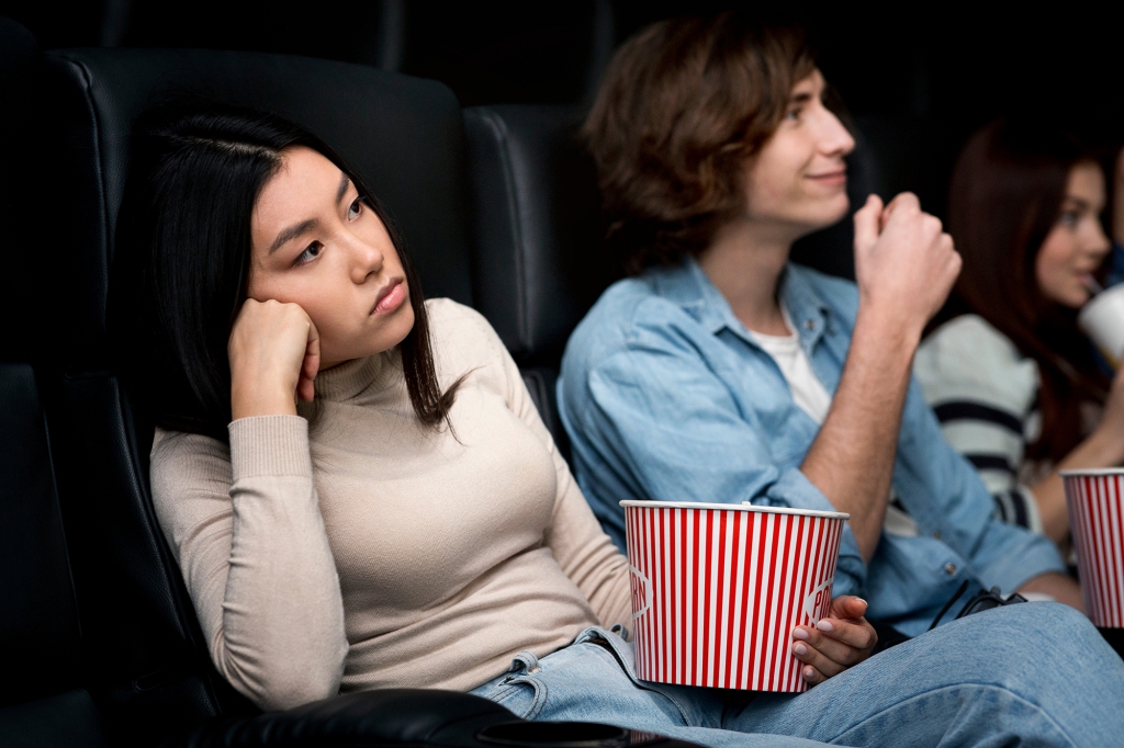 A woman said her movie date kept trying to hold her hand. 