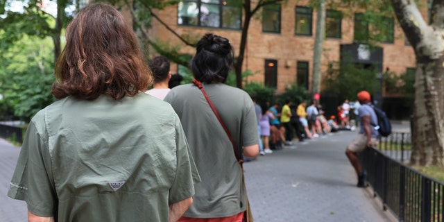 NEW YORK, NEW YORK - JULY 08: People wait in line to enter the Chelsea Sexual Health Clinic on July 08, 2022 in New York City. The Chelsea Sexual Health Clinic is one of two locations, currently administering a vaccine for monkeypox in NYC. 