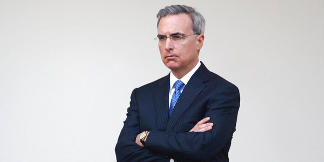 White House counsel Pat Cipollone listens as President Donald Trump speaks during a coronavirus task force briefing in the Rose Garden of the White House, March 29, 2020, in Washington. 