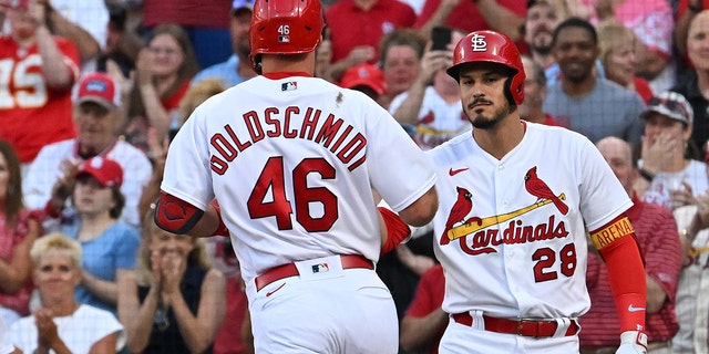 St. Louis Cardinals third baseman Nolan Arenado (28) congratulates teammate Paul Goldschmidt (46) at home plate after his solo home run during a game against the Miami Marlins June 27, 2022, at Busch Stadium, St. Louis.