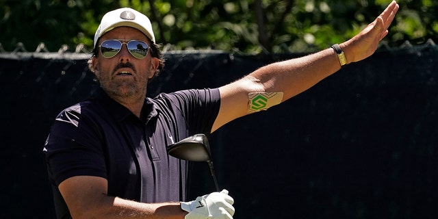 Phil Mickelson watches his tee shot on the fifth hole during a practice round ahead of the U.S. Open golf tournament, Tuesday, June 14, 2022, at The Country Club in Brookline, Mass. 