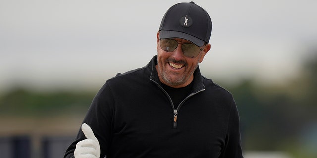 Phil Mickelson, of the U.S., gestures as he leaves the 3rd tee during the first round of the British Open golf championship on the Old Course at St. Andrews, Scotland, Thursday, July 14 2022.