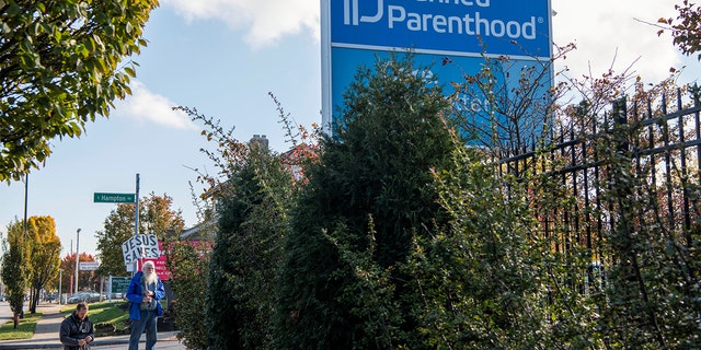 Protesters pray outside a Planned Parenthood location in Columbus, Ohio, Nov. 12, 2021.