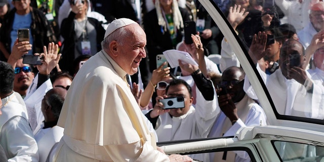 Pope Francis arrives to take part in a public Mass at Commonwealth Stadium in Edmonton, Tuesday, July 26, 2022.