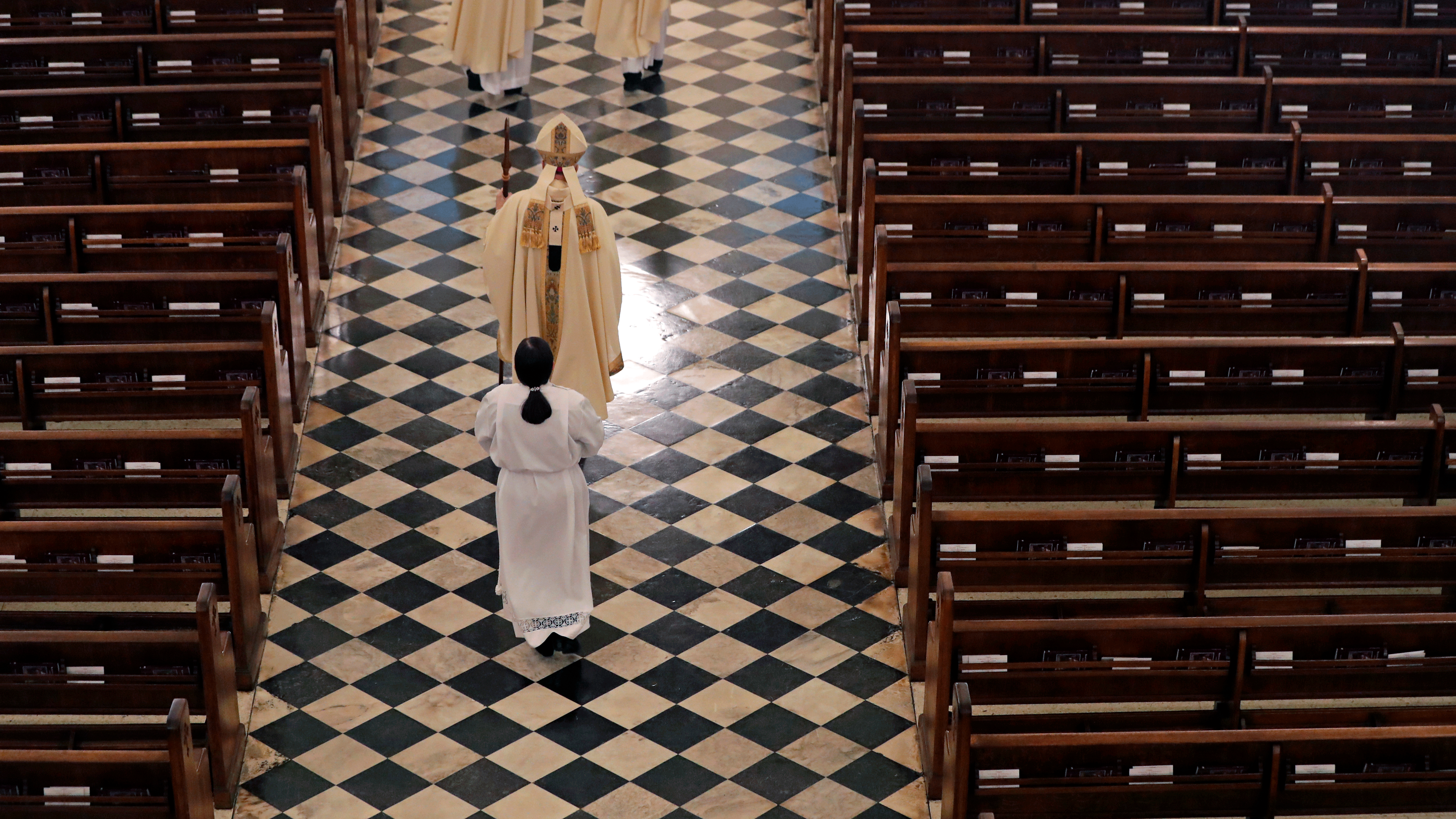 Archbishop Gregory Aymond conducts the procession to lead a livestreamed Easter Mass in St. Louis Cathedral in New Orleans, Sunday, April 12, 2020. 