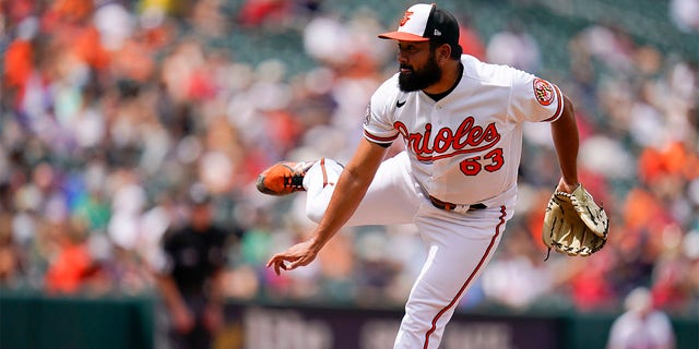 Baltimore Orioles starting pitcher Rico Garcia throws a pitch to the Los Angeles Angels during the eighth inning of a baseball game, Sunday, July 10, 2022, in Baltimore. The Orioles won 9-5 to sweep the series. 