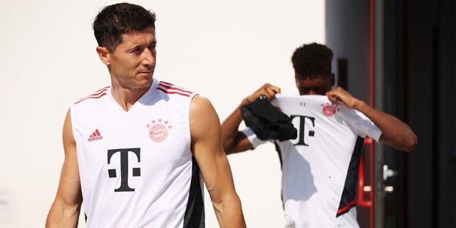 Robert Lewandowski of FC Bayern München walks onto the training pitch before a training session of FC Bayern München at Saebener Strasse training ground on July 15, 2022 in Munich, Germany.