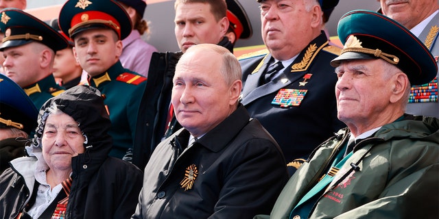 Russian President Vladimir Putin, center, attending the Victory Day military parade marking the 77th anniversary of the end of World War II in Moscow, on May 9.