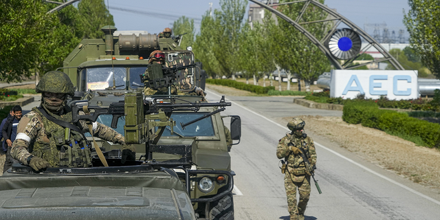 A Russian military convoy stands on the road toward the Zaporizhzhia Nuclear Power Station in southeastern Ukraine on Sunday, May 1. 