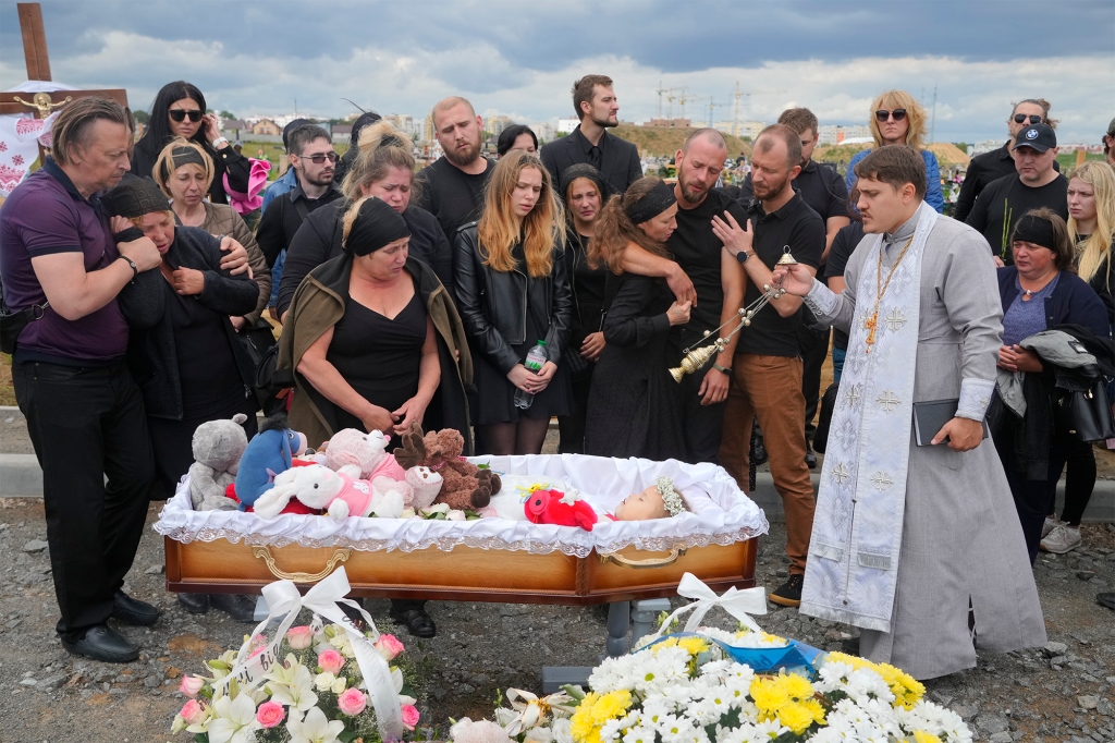 Relatives and friends attend the funeral ceremony for Liza, 4-year-old girl killed by Russian attack, in Vinnytsia, Ukraine.