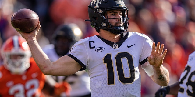 Quarterback Sam Hartman of the Wake Forest Demon Deacons looks to pass against the Clemson Tigers during a game at Clemson Memorial Stadium Nov. 20, 2021, in Clemson, S.C.