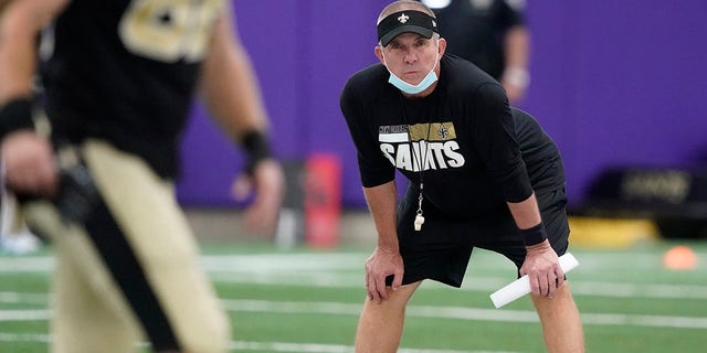 New Orleans Saints head coach Sean Payton looks on as players stretch during NFL football practice in Fort Worth, Texas, Wednesday, Sept. 15, 2021. 