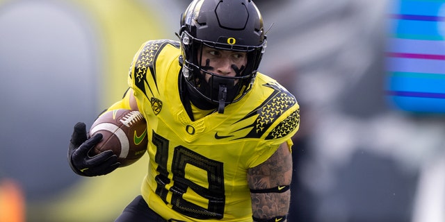 Spencer Webb of the Oregon Ducks runs with the ball against the Colorado Buffaloes at Autzen Stadium on Oct. 30, 2021, in Eugene, Oregon.