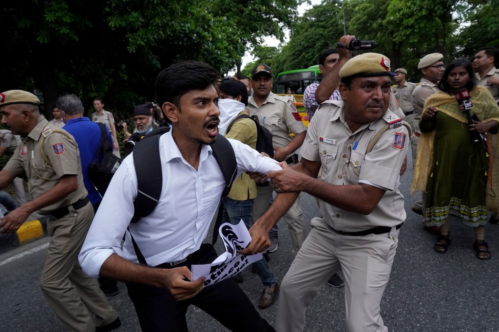 A member of Krantikari Yuva Sangathan (KYS), a student organization, gets detained during a protest in solidarity with the people of Sri Lanka, outside Sri Lankan High Commission in New Delhi, India on July 14, 2022.
