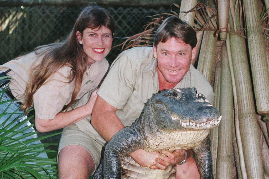 Steve Irwin holds a nine-foot female alligator, accompanied by his wife Terri in June 1999.