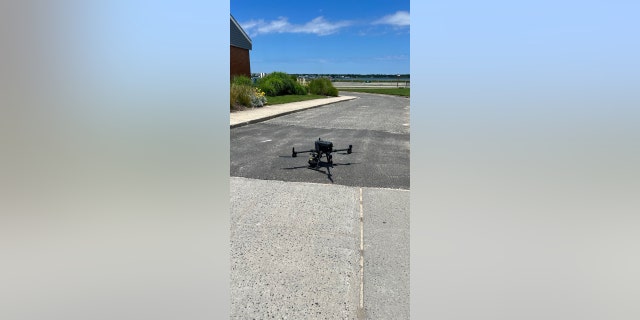 A Suffolk County Fire Rescue and Emergency Services drone sits on the ground