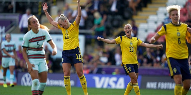 Sweden's Stina Blackstenius, center left, reacts after scoring her side's fifth goal during the Women Euro 2022 group C soccer match between Sweden and Portugal at Leigh Sports Village, in Leigh, Manchester, England, Sunday, July 17, 2022. 